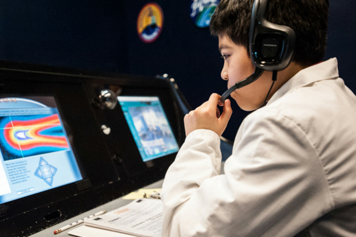 Child at mission control computer