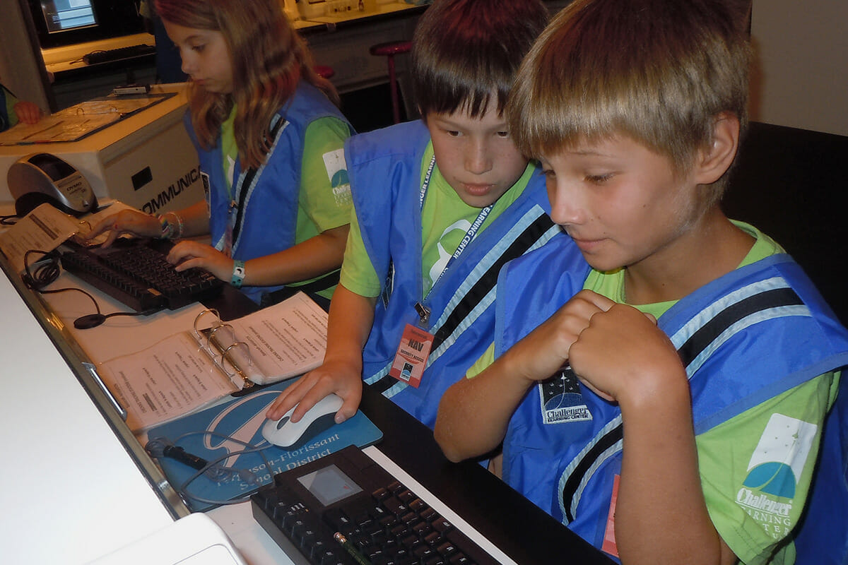 Children at mission computer
