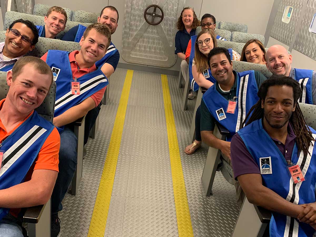 Smiling group of adults in shuttle room